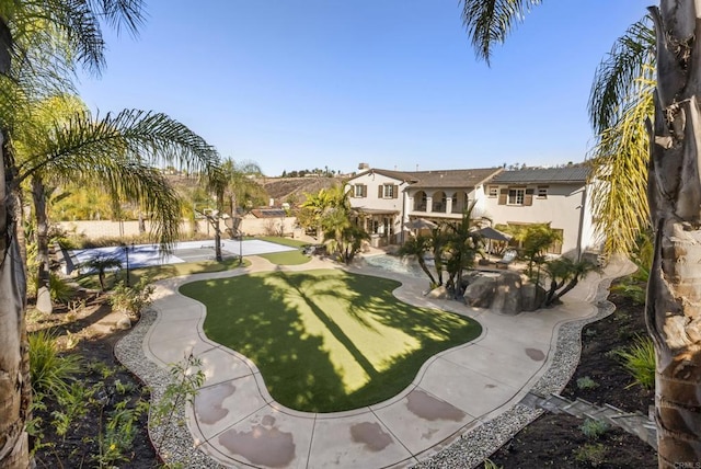 view of property's community with a patio