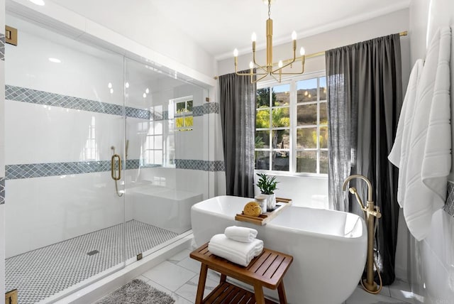 bathroom with plus walk in shower and a chandelier