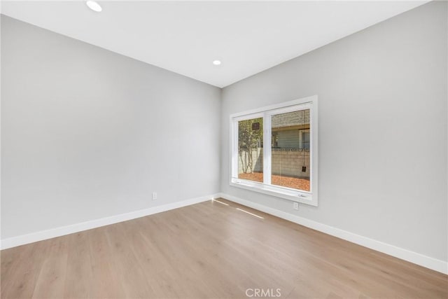 spare room featuring light hardwood / wood-style flooring