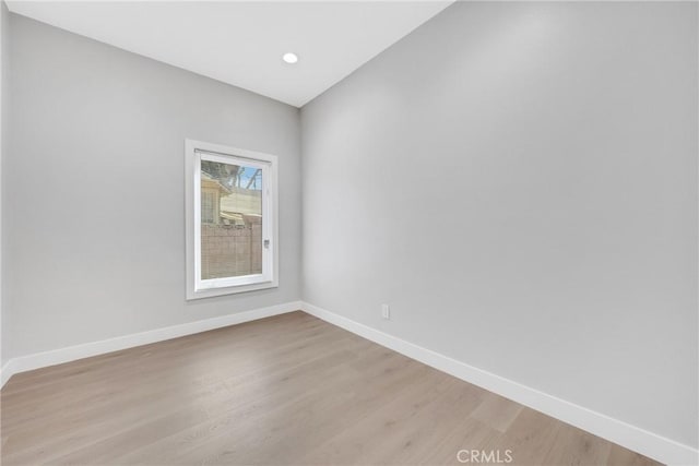 unfurnished room with light wood-type flooring