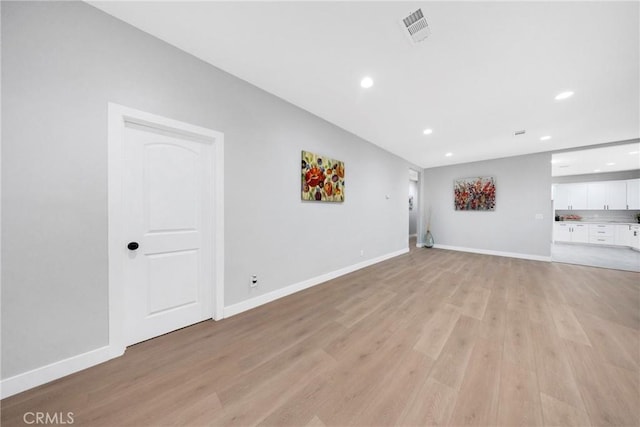 unfurnished living room with light hardwood / wood-style floors