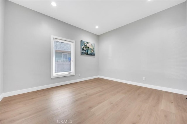 spare room with light wood-type flooring