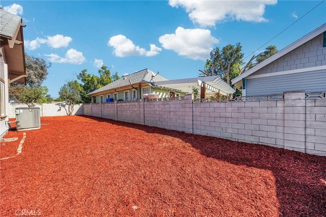 view of yard featuring central AC unit