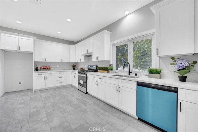 kitchen featuring light stone counters, appliances with stainless steel finishes, sink, and white cabinets