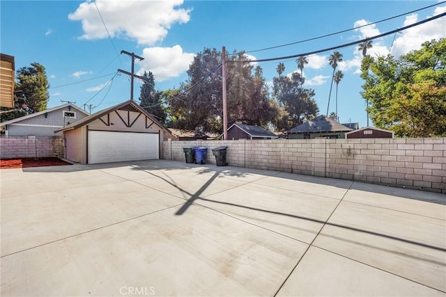 exterior space featuring a garage and an outdoor structure