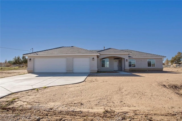 view of front of property featuring a garage