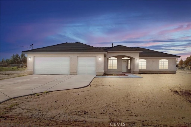 view of front of home with a garage