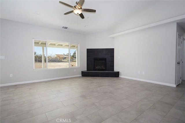 unfurnished living room featuring a fireplace and ceiling fan