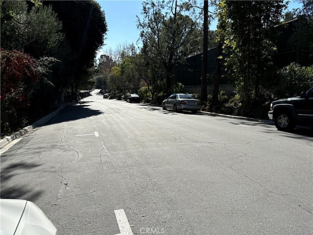 view of road with curbs