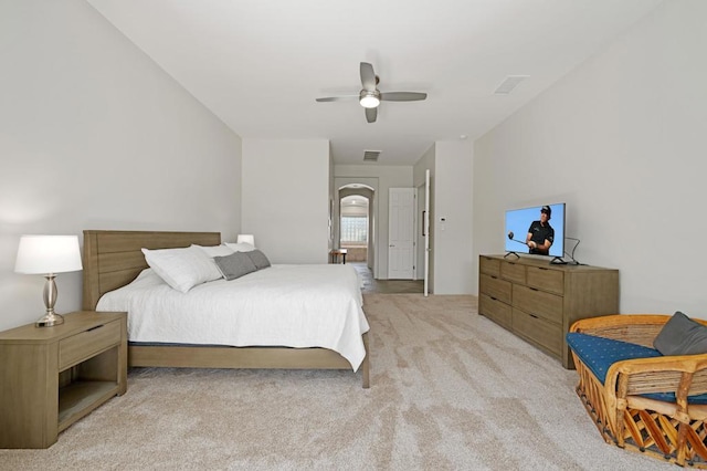 bedroom featuring ceiling fan and light carpet