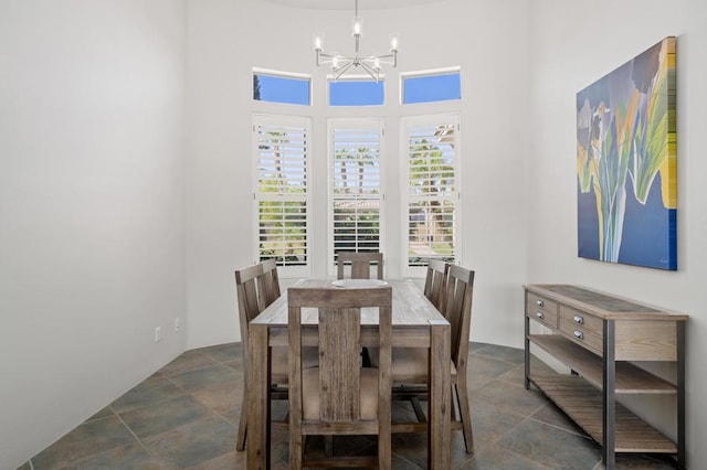 dining area featuring a notable chandelier