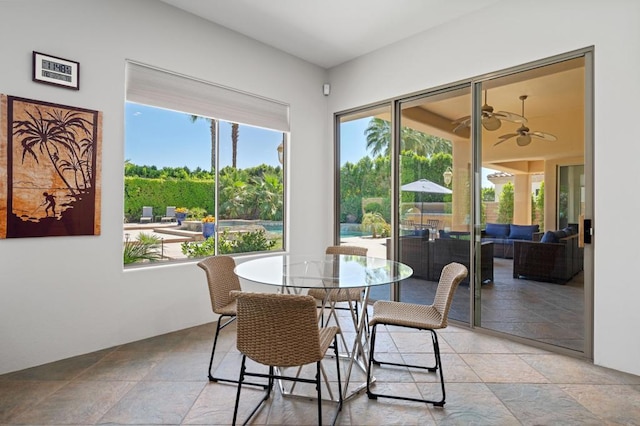 dining room featuring ceiling fan