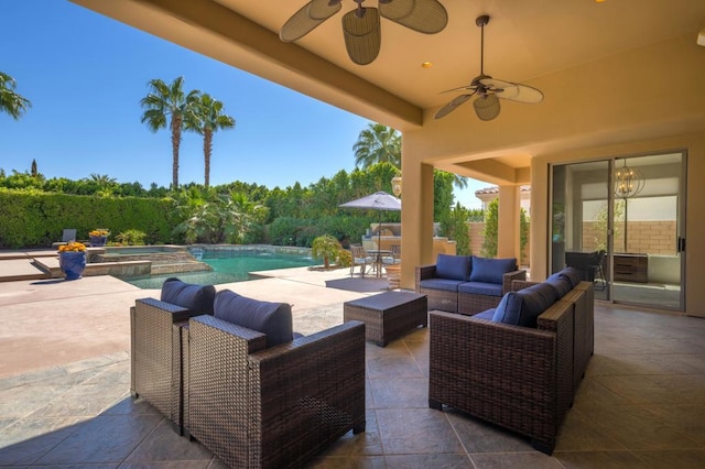 view of patio featuring a swimming pool with hot tub and outdoor lounge area