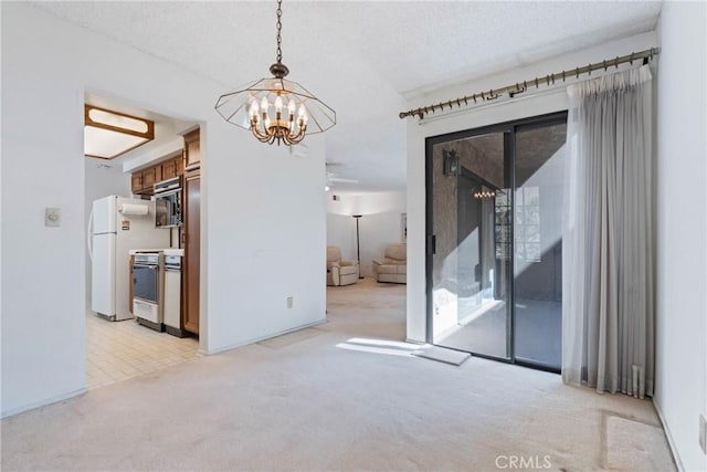 empty room featuring light carpet, a healthy amount of sunlight, a notable chandelier, and a textured ceiling