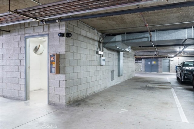 parking garage featuring concrete block wall