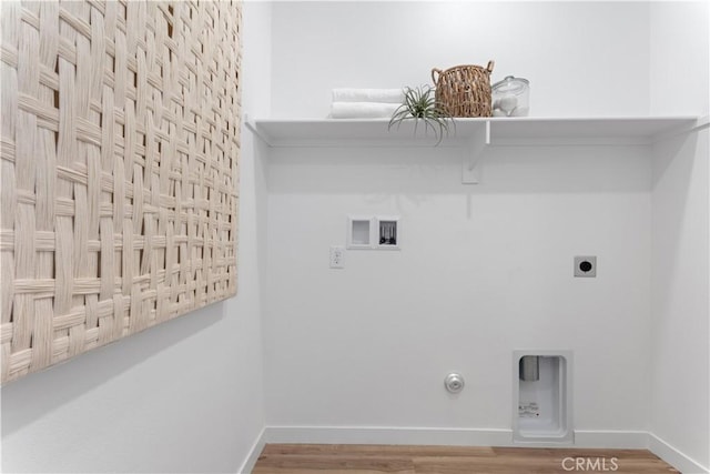 laundry room with gas dryer hookup, hookup for an electric dryer, hookup for a washing machine, and hardwood / wood-style floors