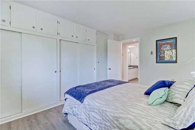 bedroom featuring light wood-type flooring