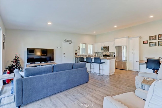 living room with light hardwood / wood-style flooring