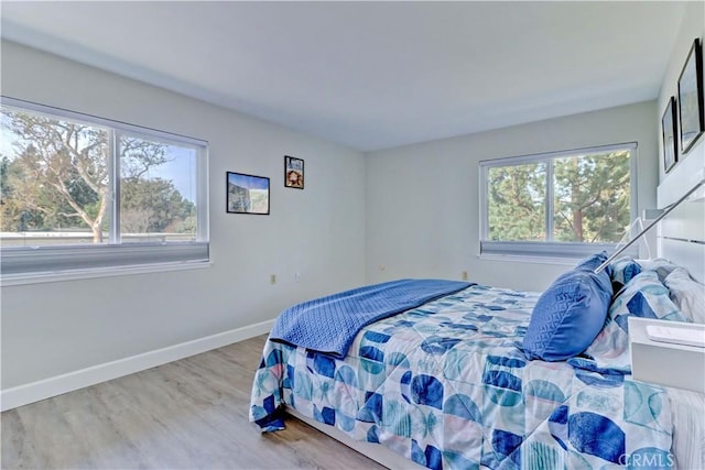 bedroom featuring light wood-type flooring