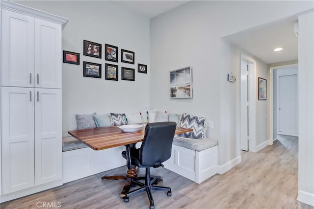 home office featuring breakfast area and light wood-type flooring