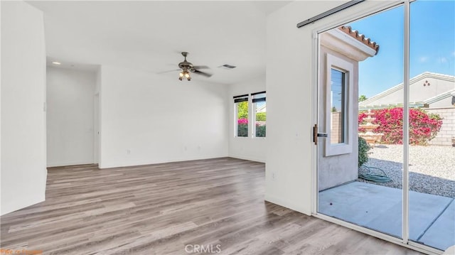 interior space featuring light wood-style flooring and a ceiling fan