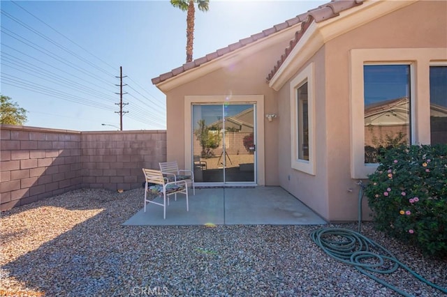 view of patio / terrace featuring fence