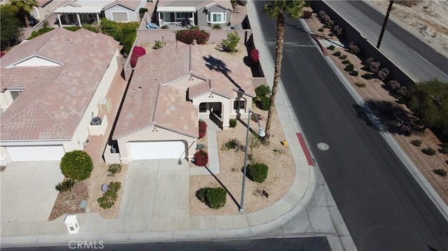 birds eye view of property with a residential view