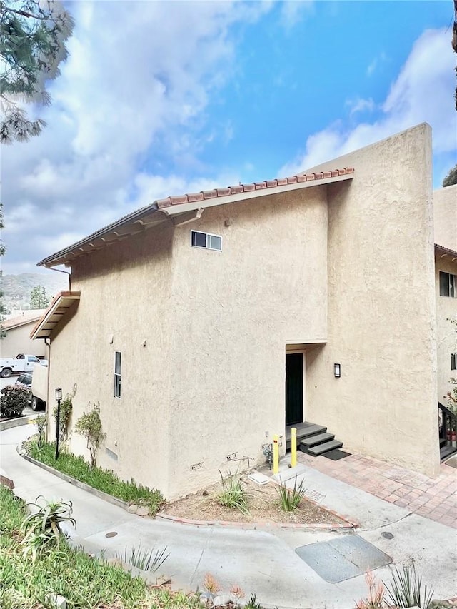 64 Avalon Terrace Rd, Avalon, CA 90704 - view of side of property featuring stucco siding