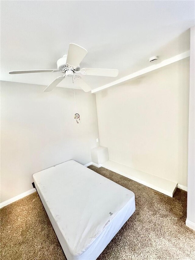 unfurnished bedroom with carpet floors and ceiling fan