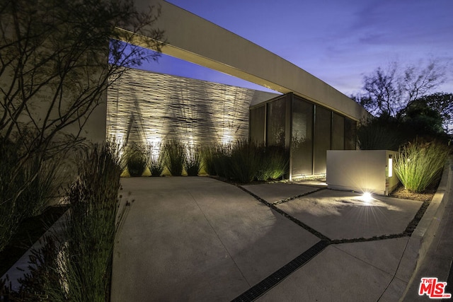 view of patio terrace at dusk