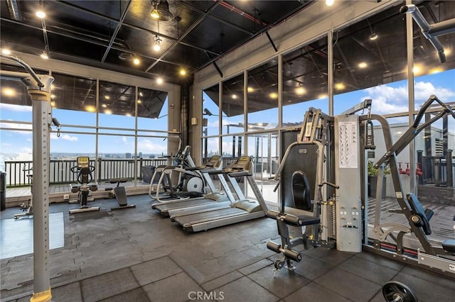 exercise room with plenty of natural light and floor to ceiling windows