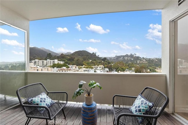 balcony featuring a mountain view