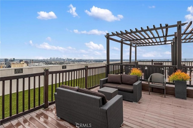 wooden deck featuring an outdoor living space, a pergola, and a lawn