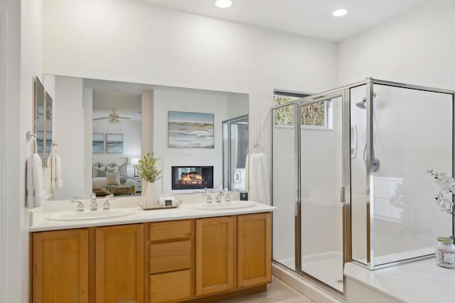 bathroom featuring vanity and an enclosed shower