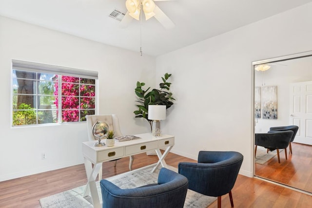 office space featuring ceiling fan and wood-type flooring