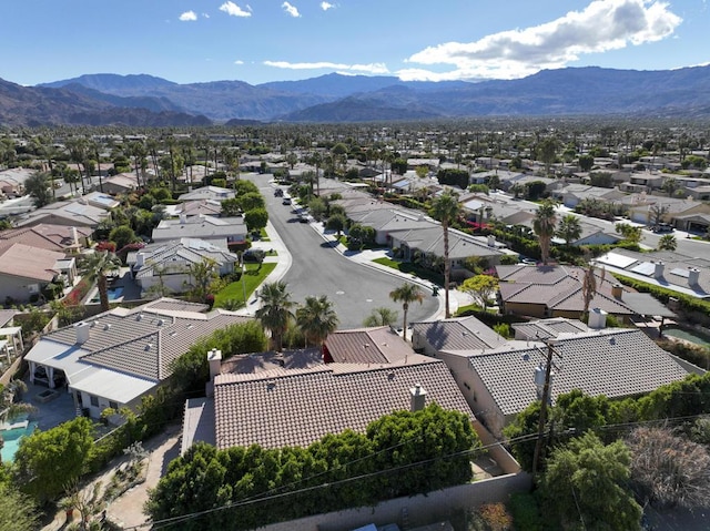 birds eye view of property featuring a mountain view