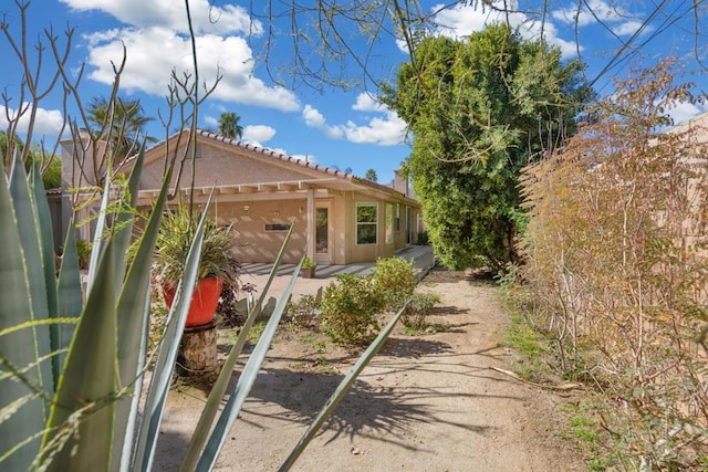 view of side of property with a patio