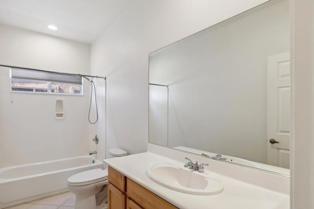 full bathroom with tile patterned floors, shower / washtub combination, toilet, and vanity