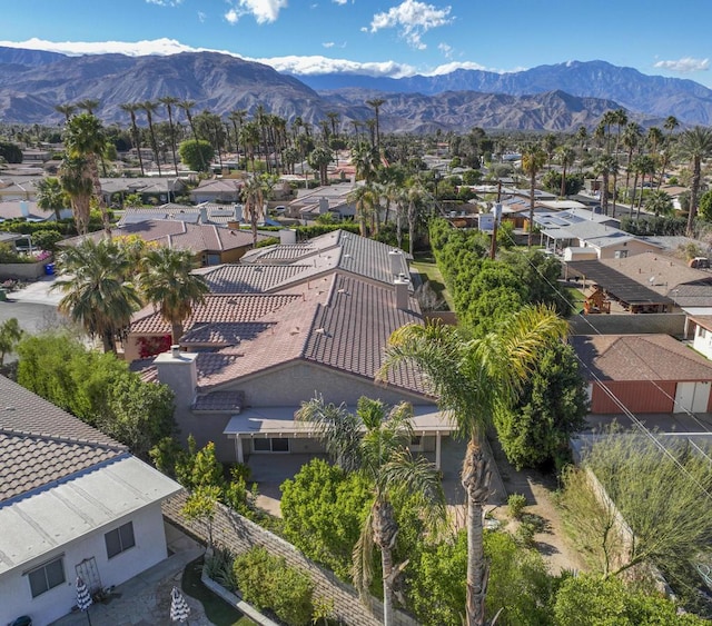 birds eye view of property featuring a mountain view