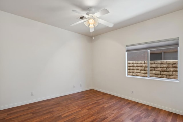 empty room with wood-type flooring and ceiling fan