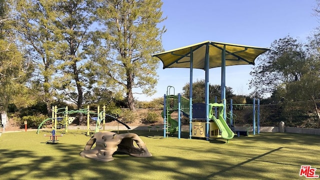 view of jungle gym featuring a yard