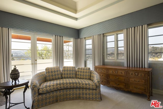 living area with carpet flooring and french doors