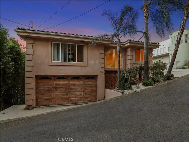 view of front of property featuring a garage