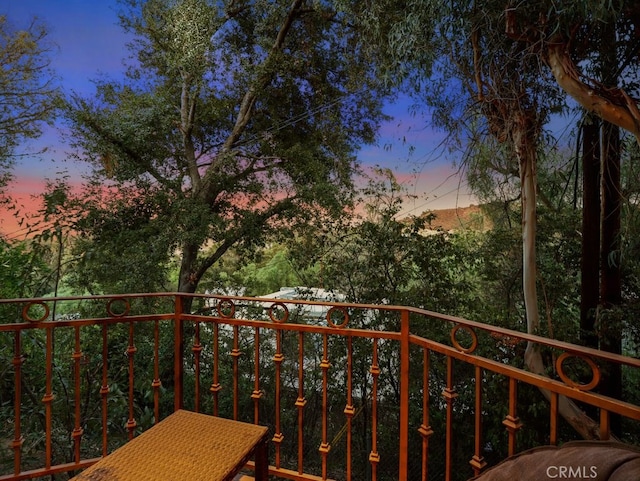 view of balcony at dusk