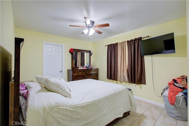 bedroom with ceiling fan and light tile patterned flooring