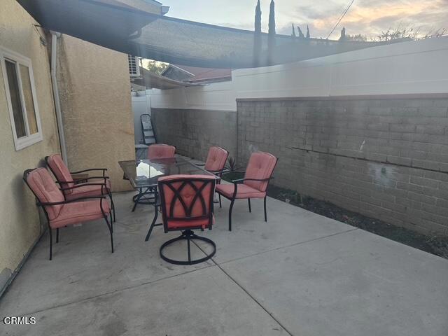 view of patio terrace at dusk