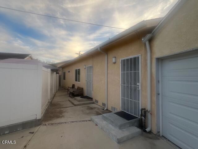 view of side of property with a garage