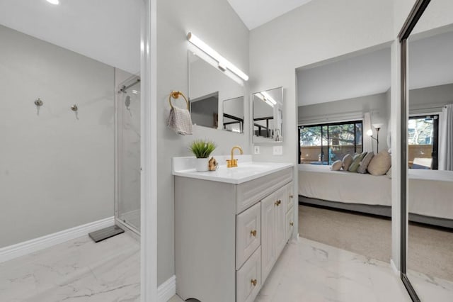 bathroom featuring vanity and a shower with shower door