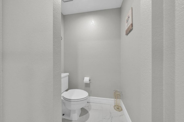 bathroom featuring toilet