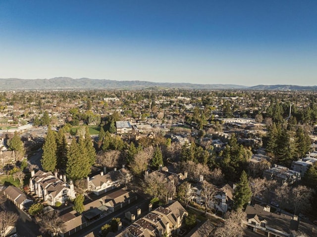 birds eye view of property featuring a mountain view